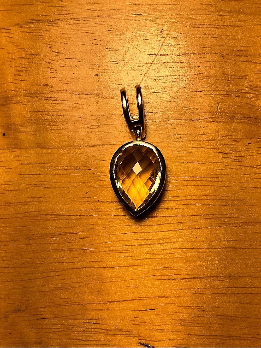 Faceted 6 gram silver and lemon quartz pendant.